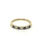 An 18ct gold sapphire and diamond half eternity ri