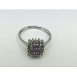 A 9ct white gold ring set with an amethyst type st