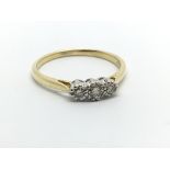 An 18carat gold ring set with three diamonds Appro