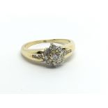An 18ct gold nine stone diamond ring with a furthe