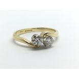 An 18ct gold two stone diamond ring, approx .40ct,