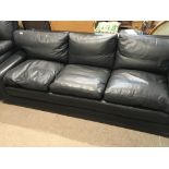 A Modern Retro design black leather sofa with drop