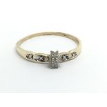 A small 9ct gold diamond cluster ring, approx 1.2g