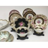 A collection of decorative porcelain tea cups on s