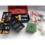 A collection of Scalextric parts including cars an