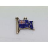 An antique 9ct gold and enamel charm in the form o