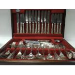 A oak case canteen of cutlery.