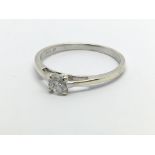 A 9carat white gold ring inset with a solitaire di