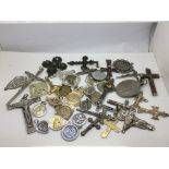 A collection of pendants and crucifixes.