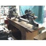 A Myford wood turning lathe 3ft (1M) single phase mounted on a sturdy chip board bench believed to