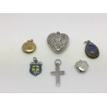 A silver heart locket, a yellow metal pendant and