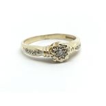 An 18ct gold solitaire diamond ring with further d