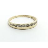 A small 9ct gold half eternity diamond ring, appro