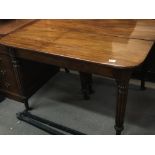 A Regency or William V Mahogany concertina action dining table. With fluted and turned legs