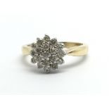 An 18ct gold diamond cluster ring, approx 1/2ct, a