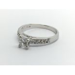 A 9carat white gold ring set with CZ stones. Ring
