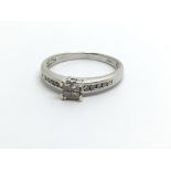 A 9ct white gold fourteen stone diamond ring, appr