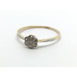 An 18carat gold ring set with a small pattern of c