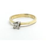 An 18ct gold solitaire diamond ring set with a sin