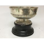A silver bowl with half fluted sides, maker Mappin
