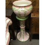 An Edwardian ceramic jardiniere and pedestal decor