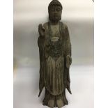 A large carved wooden figure of a buddha, approx h