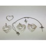 Four silver heart pendants and two silver crucifix
