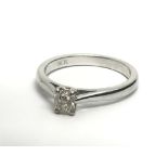 An 18ct white gold solitaire diamond ring set with