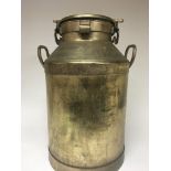 A brass milk churn with a locking lid height 57cm