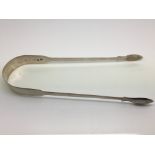A pair of silver sugar tongs, London hallmarks - N