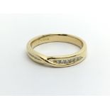An 18ct gold 12 stone half eternity ring, approx .