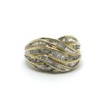 A 9carat gold ring set with intertwined rows of ba