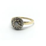 An 18carat gold ring set with a circular pattern o