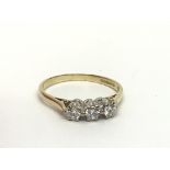 An 18ct gold three stone diamond ring, approx.25ct