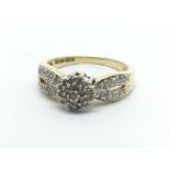A 9carat gold ring set with a pattern of diamond w