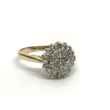 An 18ct gold diamond cluster ring, approx 1/2ct, a