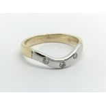 A 9ct gold three stone diamond ring, approx .10ct,