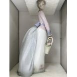 Two Lladro figures basket of love and tall yarrin.
