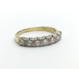 An 18ct gold seven stone diamond ring, approx .45c