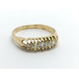 A Vintage 18carat gold ring set with a row of five