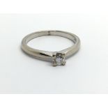 An 18carat white gold ring set with a brilliant cu