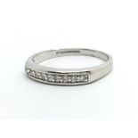 A 9ct white gold nine stone half eternity diamond