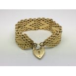 A gold plated bracelet with padlock clasp.