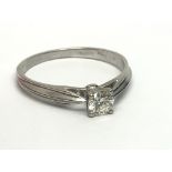 A 9ct white gold solitaire diamond ring, approx 1/