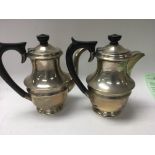 A silver coffee pot with matching hot water pot Sh