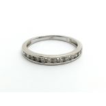 A 9ct white gold half eternity ring, approx.20ct,
