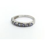 A 9carat white gold ring set with Tanzanite and di