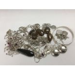 A collection of silver necklaces and other jewelle
