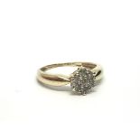 A 9ct gold seven stone diamond cluster ring, appro