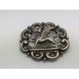 An antique silver Welsh dragon brooch.